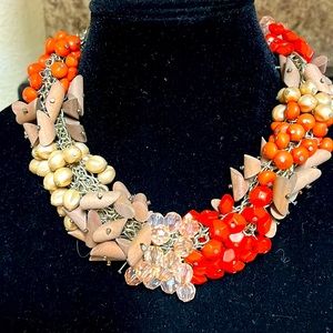 Orange, taupe, and clear stones